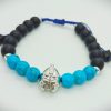 Pulsera ajustable de piedras naturales ónix mate, turquesas y dije de Gladiador plateado