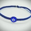 2025/08/1001177372.jpg Pulsera ajustable tejida a mano en hilo azul marino con dije de ojo turco