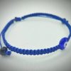 2025/08/1001177373.jpg Pulsera ajustable tejida a mano en hilo azul marino con dije de ojo turco