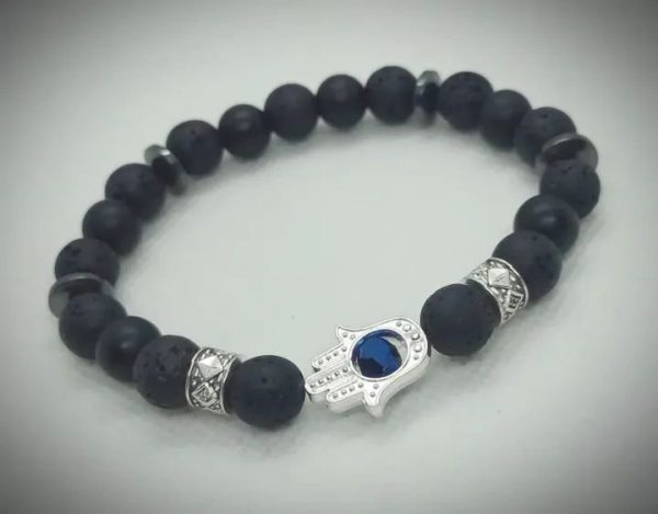 Pulsera de piedras naturales ónix mate, roca volcánica y dije de mano de Fátima plateado