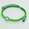 Pulsera tejida a mano en hilo bicolor con ojo turco
