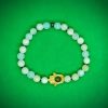 2026/01/1002494198.jpg Pulsera elástica de piedras naturales Jade con dije de mano de Fátima en chapa de oro
