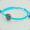 Pulsera ajustable tejida a mano con flor de cristales facetados
