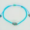 Pulsera ajustable tejida a mano con flor de cristales facetados