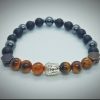 2026/01/1002582069.jpg Pulsera de Buda plateado con piedras naturales ónix, hematita y ojo de tigre
